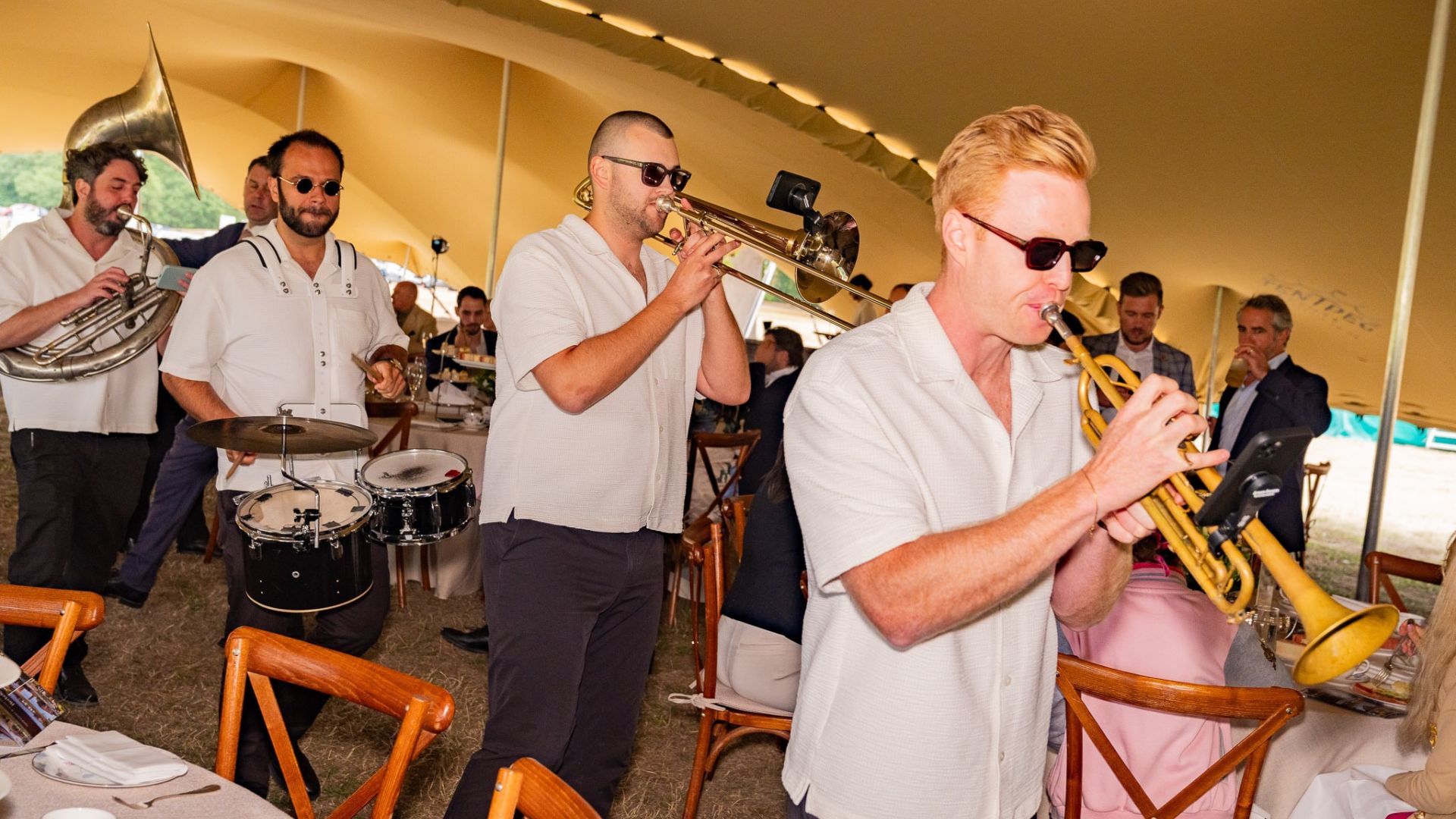 Live brass band performing at a polo event in Ascot